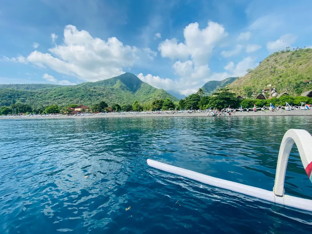 Snorkeling from a traditional jukung on the Amed coast